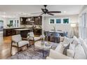 Bright, open-concept living space featuring hardwood floors and a combined living, dining, and kitchen area at 1735 Jobeth Se Ave, Atlanta, GA 30316