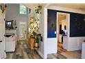 Bright foyer featuring hardwood floors, fireplace, and access to the kitchen at 1951 Barrett Knoll Nw Cir, Kennesaw, GA 30152