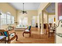 Bright living room with hardwood floors, a ceiling fan, and large windows at 3221 Abbott Dr # 5, Powder Springs, GA 30127