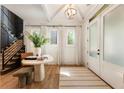 Bright entryway with hardwood floors, a round table, and white trim, creates a welcoming and airy atmosphere at 3233 Osborne Ne Rd, Brookhaven, GA 30319