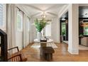 Bright entryway with hardwood floors, a round table, and white trim, creates a welcoming and airy atmosphere at 3233 Osborne Ne Rd, Brookhaven, GA 30319