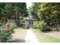 Charming pool house featuring brick facade and traditional-style doors at 4663 Mossey Dr, Lithonia, GA 30038