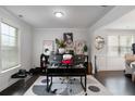 Bright home office featuring large windows, a modern desk setup, and tasteful decor at 3692 Wartrace Dr, South Fulton, GA 30331