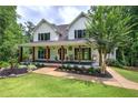 Inviting two-story home with a spacious front porch at 6095 Fords Nw Rd, Acworth, GA 30101