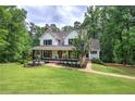 Beautiful two-story home with a well-manicured lawn at 6095 Fords Nw Rd, Acworth, GA 30101