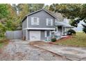 Charming two-story home featuring a gray exterior and a well-maintained front yard at 2573 Mistletoe Ln, Snellville, GA 30039