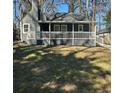 Attractive home featuring a covered porch, fresh exterior paint, and a well-manicured front yard at 1457 Richland Sw Rd, Atlanta, GA 30310