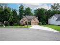 Charming home on a cul-de-sac with a well-manicured lawn and a spacious driveway at 7185 Hartsfield Pl, Suwanee, GA 30024