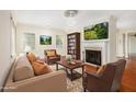 Cozy living room with fireplace, hardwood floors, and ample natural light at 961 Lindbergh Ne Dr, Atlanta, GA 30324