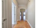 Hallway with hardwood floors leading into a bright and open living space at 2500 Rosehill Cir, Lithia Springs, GA 30122