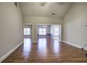 Spacious living room with hardwood floors and open access to other rooms at 2500 Rosehill Cir, Lithia Springs, GA 30122