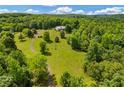 Secluded home on large lot with mature trees and a winding drive at 195 Connesena Rd, Kingston, GA 30145