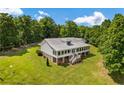 Exterior view of home showcasing large yard and metal roof at 195 Connesena Rd, Kingston, GA 30145