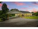 Charming home exterior with a covered parking area and inviting front porch at 195 Connesena Rd, Kingston, GA 30145