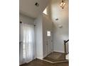 Bright foyer with high ceilings, hardwood floors, and natural light at 3040 Ivey Oaks Ln, Roswell, GA 30076