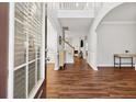 Bright foyer with high ceilings, hardwood floors, and views into the living space at 3569 Tupelo Trl, Auburn, GA 30011