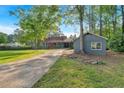 Long driveway leading to a charming home and a detached garage at 1731 Maryland Sw Ave, Marietta, GA 30008