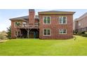 The spacious backyard includes a deck and plenty of room for outdoor activities at 4457 Equity Ct, Ellenwood, GA 30294