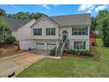 Charming two-story home with a two-car garage and well-maintained front yard at 3383 Spirit Nw Dr, Kennesaw, GA 30144