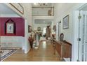 Bright foyer with hardwood floors, high ceilings, and open staircase at 3871 Lake Juliette Dr, Buford, GA 30519