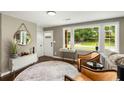 Inviting living room with large windows, neutral tones, stylish furnishings, and modern decor at 1981 Shalimar Ne Dr, Atlanta, GA 30345