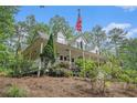 Beautiful home featuring a classic design with a spacious front porch and surrounding greenery at 83 Shipp Cir, Hiram, GA 30141