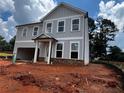 Charming two-story home with gray siding, white trim and a welcoming front porch at 1716 Hickory Heights (Lot 2) Way, Acworth, GA 30102
