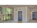 Unit 1213 entrance featuring a black front door, overhead lantern, and a small entrance mat at 1250 Parkwood Se Cir # 1213, Atlanta, GA 30339