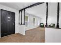 Inviting entryway featuring a decorative front door and a view into a spacious living area with natural light at 3332 Oak Grove Rd, Loganville, GA 30052