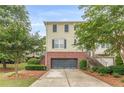 Attractive townhome featuring a 2-car garage, brick facade and well-maintained green spaces at 4228 Laurel Creek Se Ct # 6, Smyrna, GA 30080