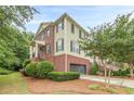 Charming two-story home features a brick foundation, light green siding, and a well-manicured lawn at 4228 Laurel Creek Se Ct # 6, Smyrna, GA 30080