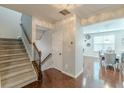 Inviting foyer showcasing hardwood floors and a staircase leading to the upper level at 4228 Laurel Creek Se Ct # 6, Smyrna, GA 30080