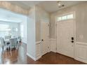 Welcoming foyer with hardwood floors, wainscoting, and a view into the elegant dining room at 4228 Laurel Creek Se Ct # 6, Smyrna, GA 30080