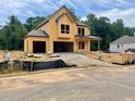 Exterior view of home under construction showing the framing and some roof work at 723 Crest Line Trl, Powder Springs, GA 30127