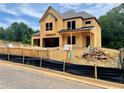 Exterior view of home under construction showing the framing and some roof work at 723 Crest Line Trl, Powder Springs, GA 30127