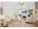 Spacious living room featuring an inviting fireplace and seamless transition into the dining area at 333 Lauren Ln, Woodstock, GA 30188