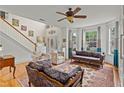 Inviting living room with high ceilings, hardwood floors, staircase, and plenty of natural light at 638 Glen Valley Way, Dacula, GA 30019