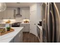 Contemporary kitchen features an island with barstool seating, modern fixtures, and stainless steel appliances at 1007 Crown Oak St # 45, Johns Creek, GA 30022