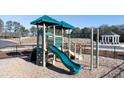 Community playground with slide and climbing structures at 1400 Gray Branch Dr, Lawrenceville, GA 30045