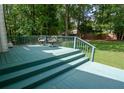 Backyard deck with outdoor seating overlooking the expansive backyard at 402 Princeton Way, Lawrenceville, GA 30044