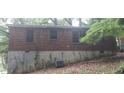 Rear exterior of home with brick exterior and partial view of the air conditioning system at 2980 Wanda Sw Cir, Atlanta, GA 30315