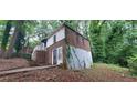 View of the side of the house showing the brick exterior, sidewalk, and landscaping at 2980 Wanda Sw Cir, Atlanta, GA 30315