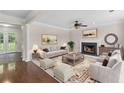 Spacious living room with fireplace, crown molding, and neutral decor at 405 Mount Vernon Ct, Woodstock, GA 30189