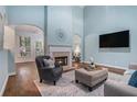 Light filled living room features a fireplace, hardwood floors, and an open floor plan for comfortable living at 2063 Willow Chase Ct, Tucker, GA 30084