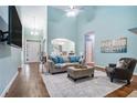 Spacious living room with fireplace, hardwood floors, and plenty of natural light showcasing comfortable home living at 2063 Willow Chase Ct, Tucker, GA 30084