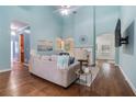 Bright living room features high ceilings, a ceiling fan and a fireplace, creating a cozy and inviting atmosphere at 2063 Willow Chase Ct, Tucker, GA 30084