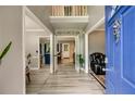 Inviting foyer with hardwood floors, a view of open living spaces, and a bright blue front door at 41 Wexford Nw Cir, Cartersville, GA 30121