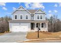 Beautiful two-story home with a covered porch, white trim, and a well-manicured lawn at 109 Laurelwood Ln, Dallas, GA 30157