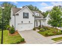 Beautiful home showcasing manicured lawn, tasteful landscaping and a welcoming front porch at 309 Mcdaniel Pl, Canton, GA 30115