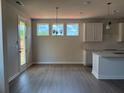 Open dining area with natural light streaming through the windows at 344 Riverwood Pass, Dallas, GA 30157